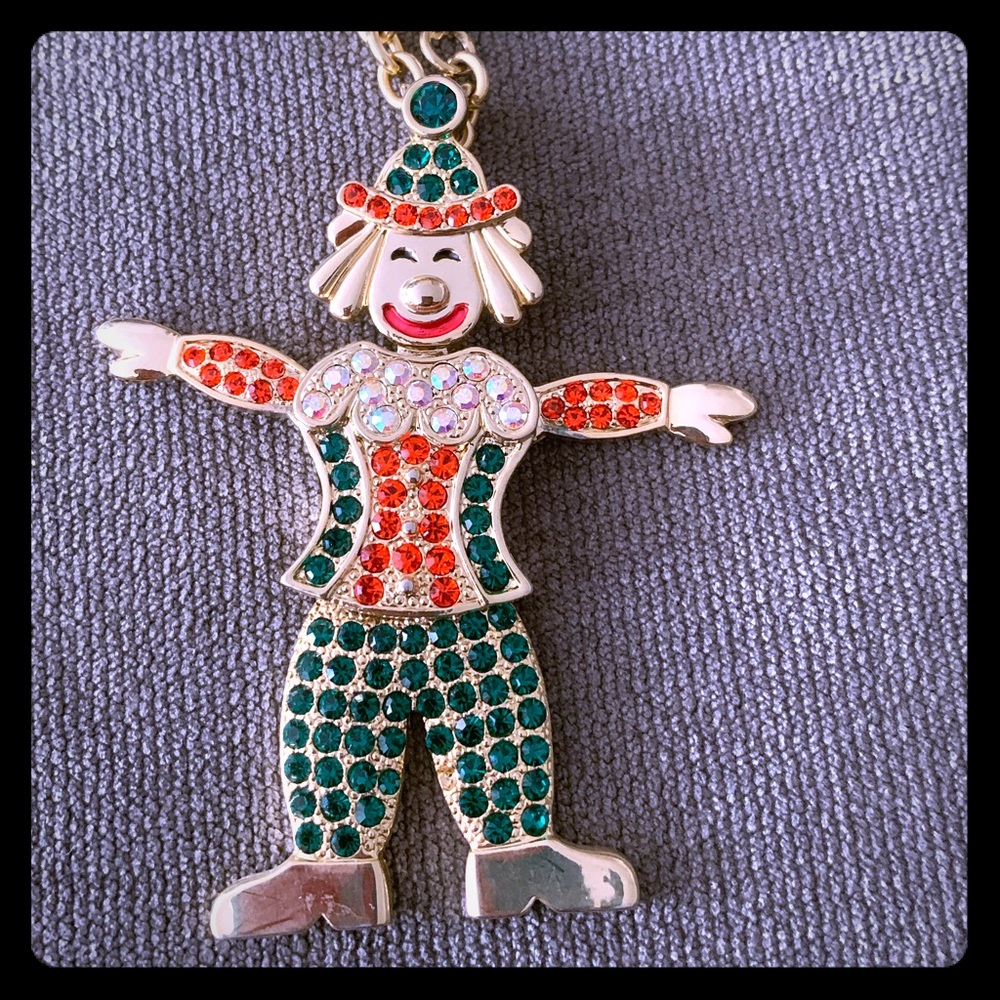 Fun fashionable clown necklace. Moving hands